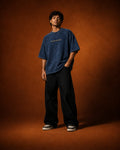 UpClothing Moneyfesting 240 Midnight navy acid wash oversized T-shirt — editorial model view, full-frame 4:5