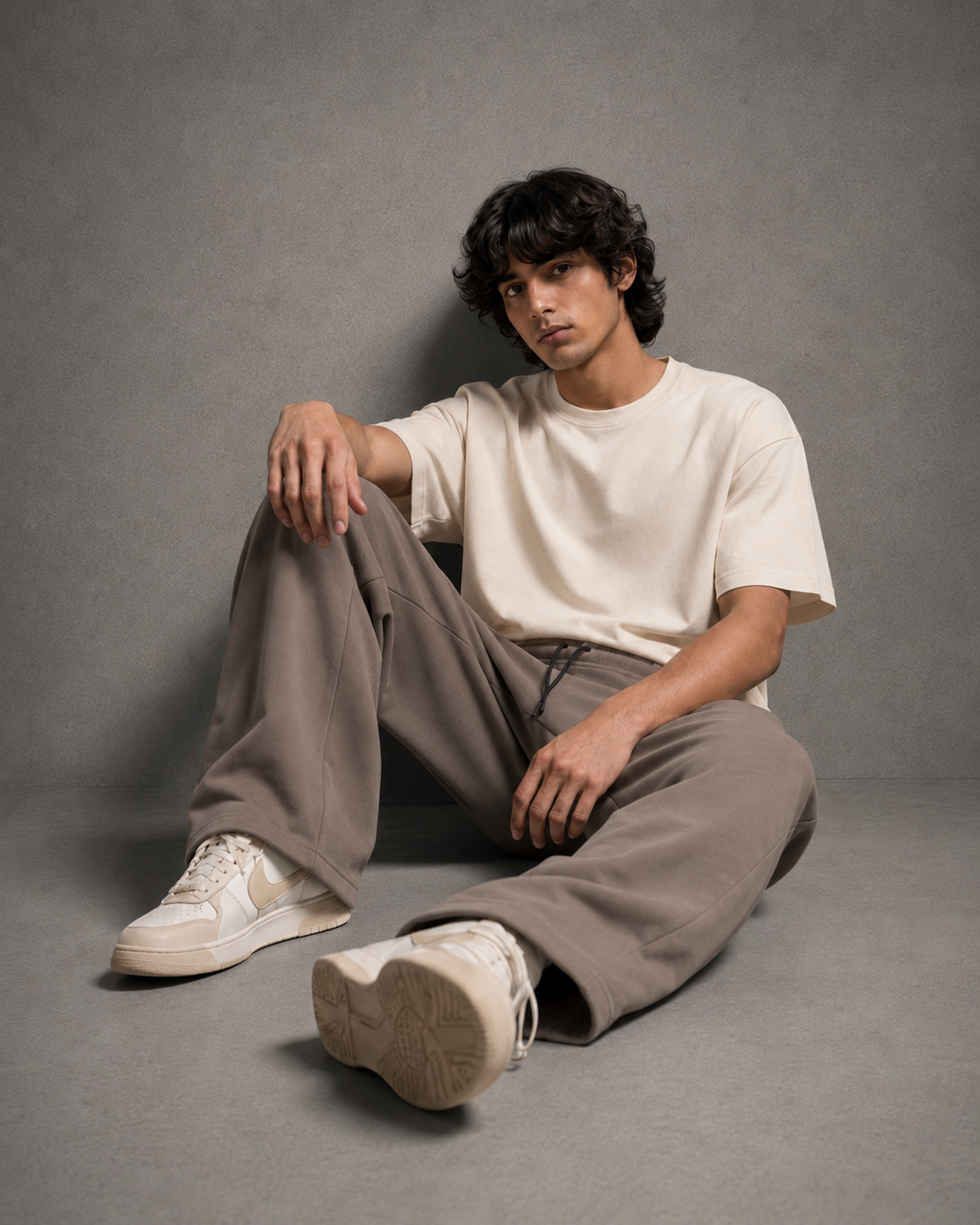 UpClothing Seoul Pleat Wide-Leg Joggers in Mocha seated editorial view