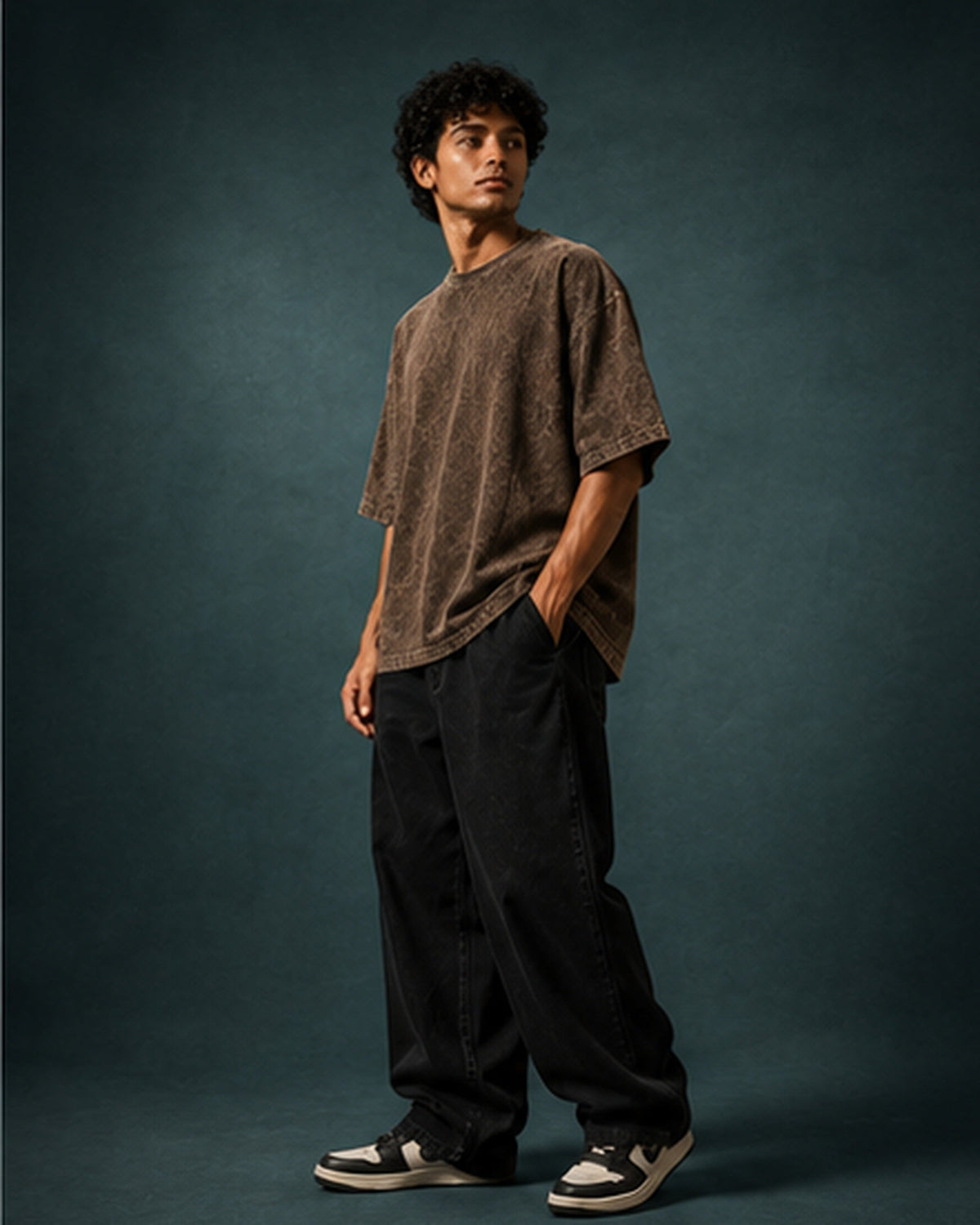 UpClothing Core Wash 240 Brown acid wash oversized T-shirt — editorial hero on teal slate studio backdrop
