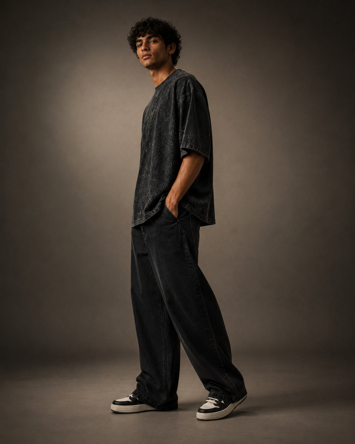 UpClothing Core Wash 240 Onyx Black acid wash oversized T-shirt — three-quarter editorial fit view