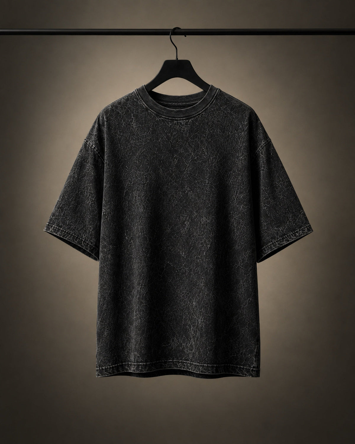 UpClothing Core Wash 240 Onyx Black acid wash oversized T-shirt — hanger product view showing construction and shape