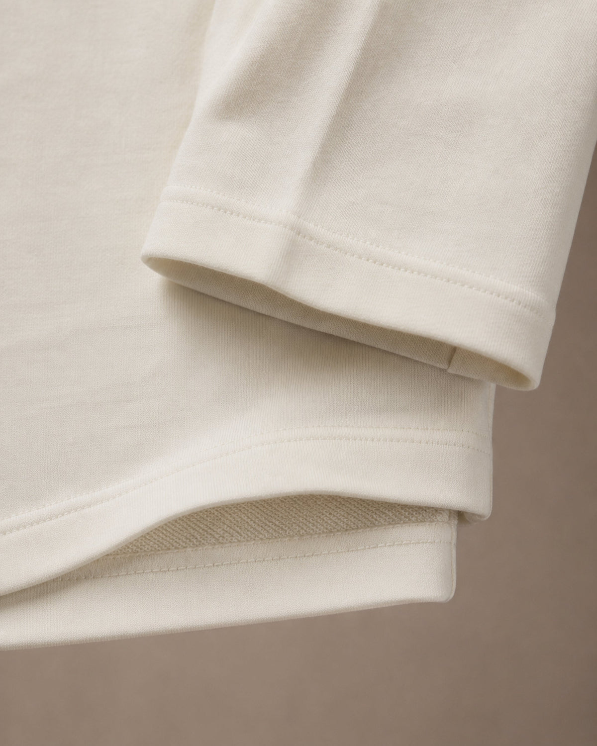 UpClothing Core 240 Bone off-white heavyweight oversized T-shirt — sleeve and hem construction detail