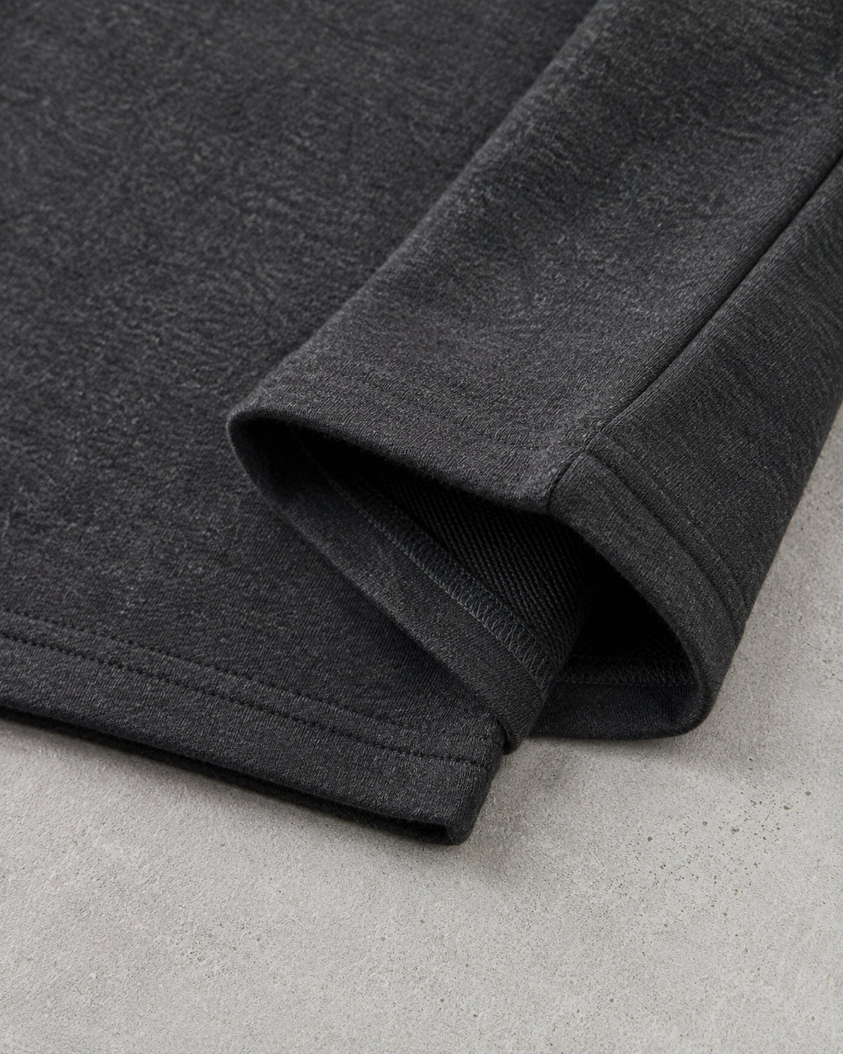 UpClothing Core 240 Graphite dark charcoal melange heavyweight oversized T-shirt — sleeve and hem construction detail