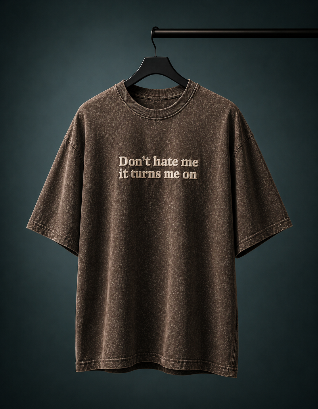 UpClothing Don't Hate Me 240 Mocha Brown acid wash oversized T-shirt — hanger product view on Teal Slate backdrop