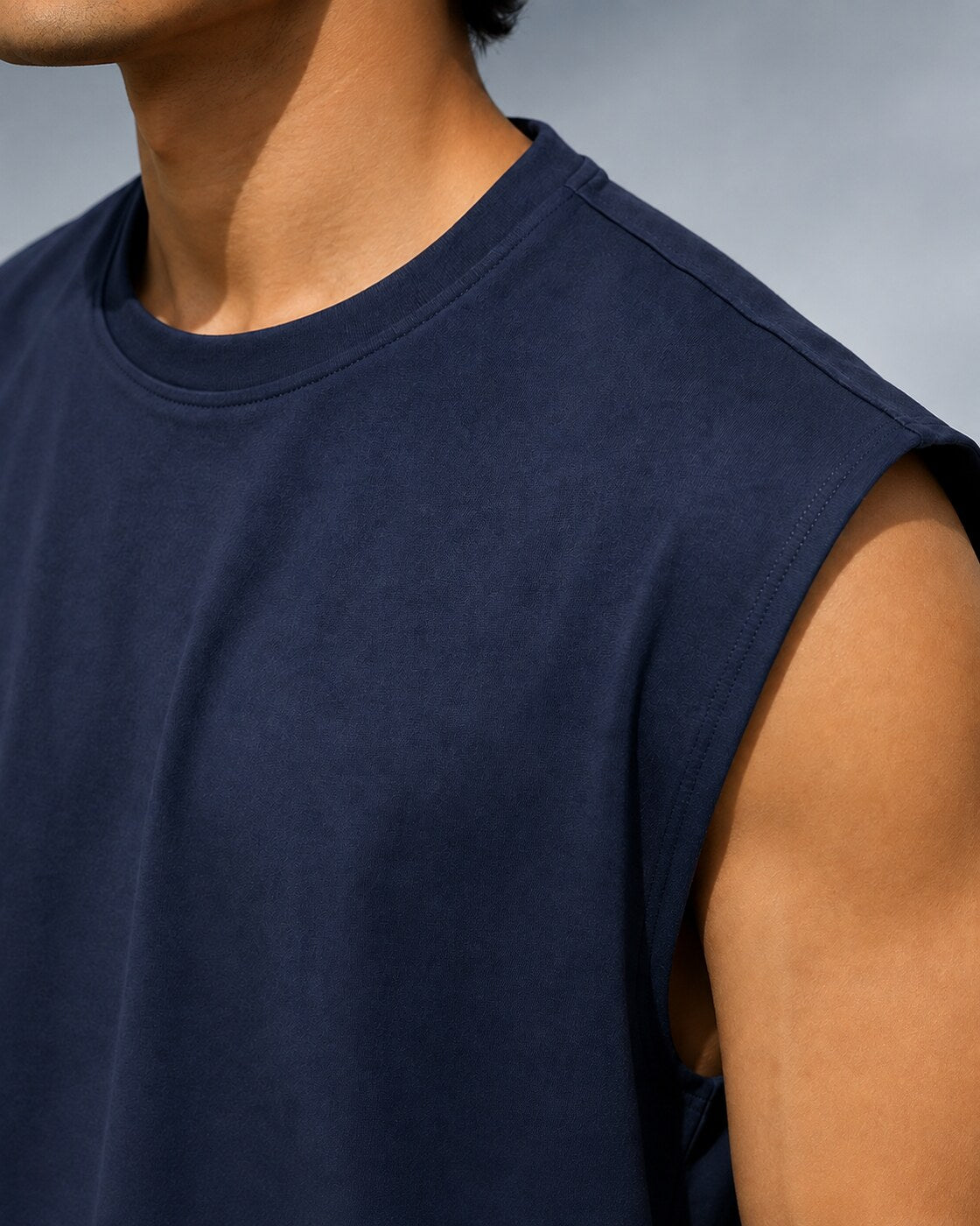 Close-up of neckline, shoulder seam and cotton texture on UpClothing Navy oversized vest