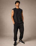 Indian male model wearing UpClothing Off-Duty Oversized Vest in Onyx Black front view